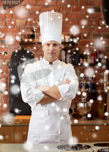 Image of happy male chef cook in restaurant kitchen