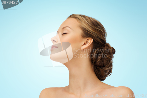 Image of young woman face side view and shoulders