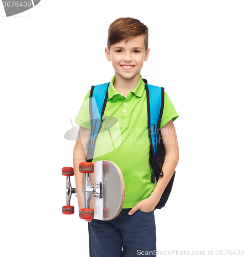 Image of happy stdent boy with backpack and skateboard