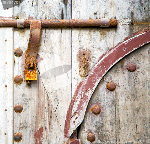 Image of brown  morocco in africa the old wood  facade home and rusty saf
