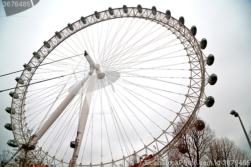 Image of london eye in  spring sky and white clouds