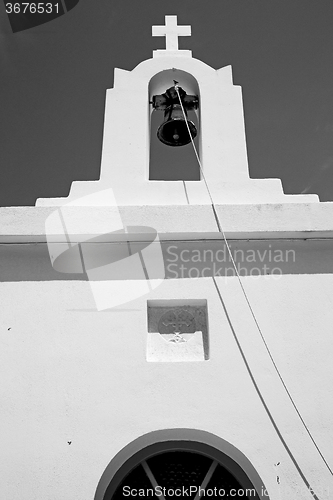 Image of in cyclades      europe greece a cross the cloudy sky and bell