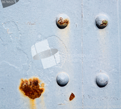 Image of blue   handle in london antique  door  rusty  brass nail and lig