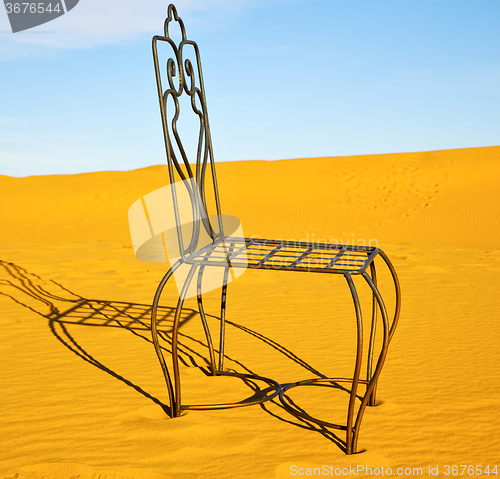 Image of table and seat in desert  sahara morocco   africa yellow sand