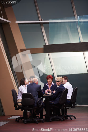 Image of business people group on meeting at modern bright office