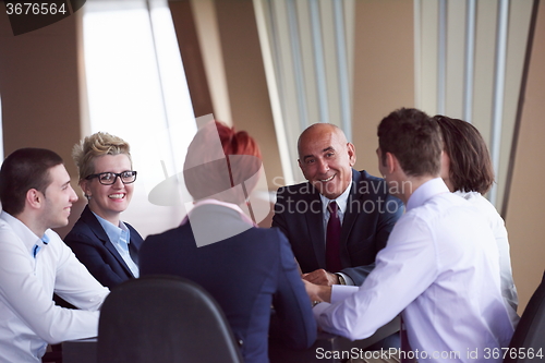 Image of business people group on meeting at modern bright office