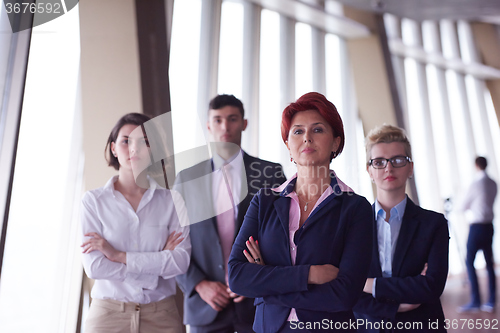 Image of diverse business people group with redhair  woman in front