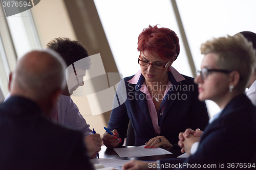 Image of business people group sign contract