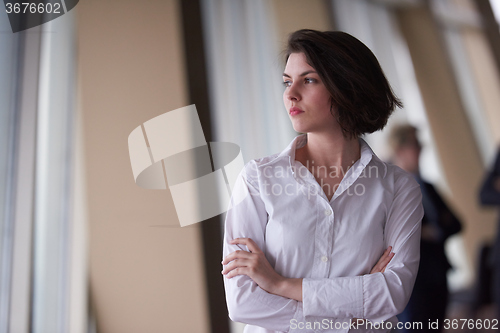 Image of business people group, woman in front  as team leader