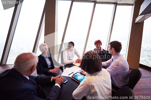 Image of business people group on meeting at modern bright office