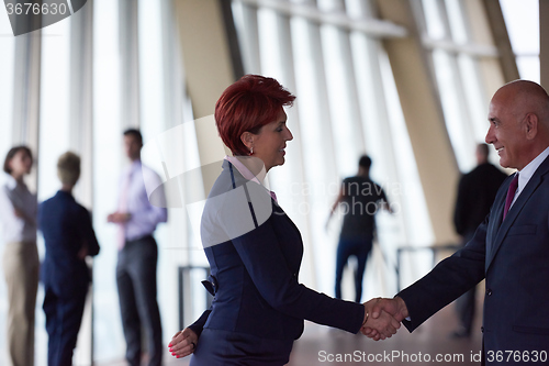 Image of handshake of business woman and man