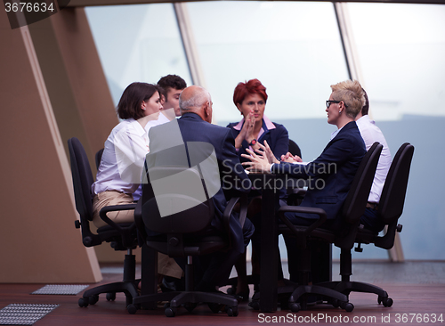 Image of business people group on meeting at modern bright office