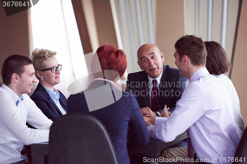 Image of business people group on meeting at modern bright office