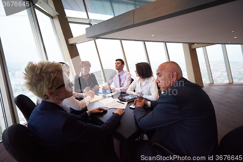Image of business people group on meeting at modern bright office