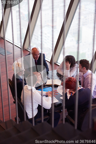 Image of business people group on meeting at modern bright office