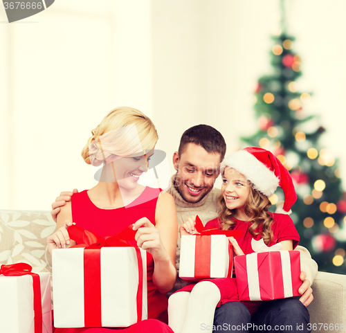 Image of happy family opening gift boxes