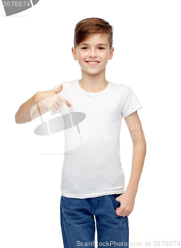 Image of happy boy pointing finger to his white t-shirt