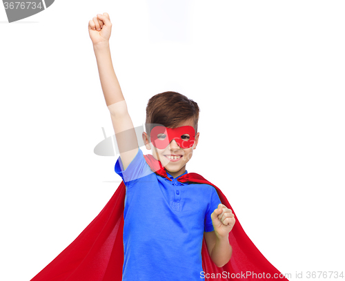 Image of boy in red super hero cape and mask showing fists