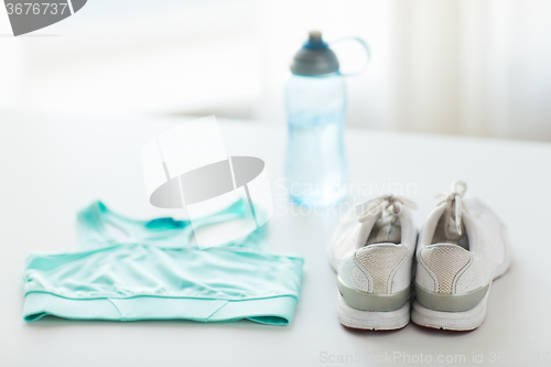 Image of close up of female sports clothing and bottle set