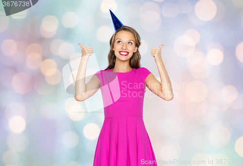 Image of happy young woman or teen girl in party cap