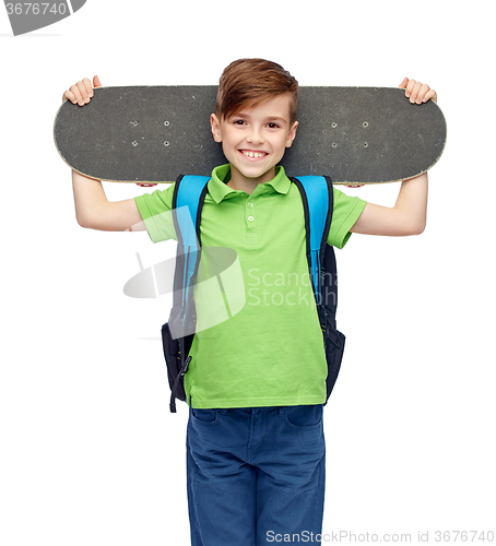 Image of happy student boy with backpack and skateboard