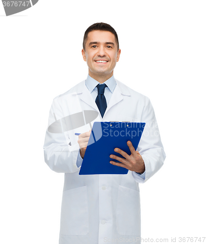 Image of smiling male doctor with clipboard writing