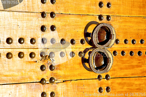 Image of rusty  brown    morocco in africa the old wood  facade 