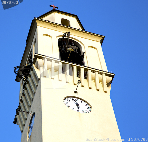 Image of olgiate wall  and church tower bell sunny day 