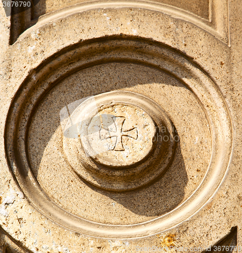 Image of lonate pozzolo lombardy   wall of a curch circle  pattern  cross