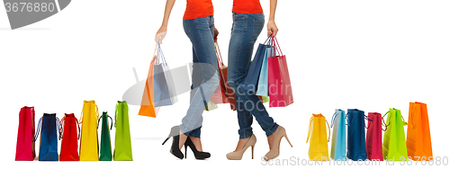 Image of close up of women with shopping bags