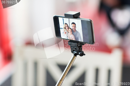 Image of close up of happy family selfie on smartphone