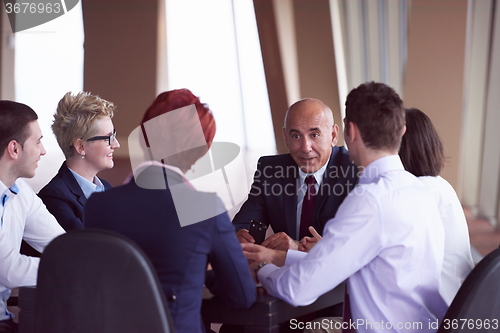 Image of business people group on meeting at modern bright office