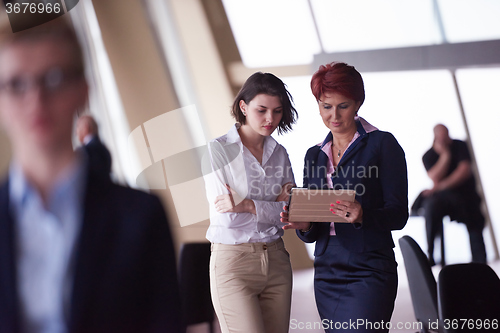 Image of business people group, woman in front  as team leader