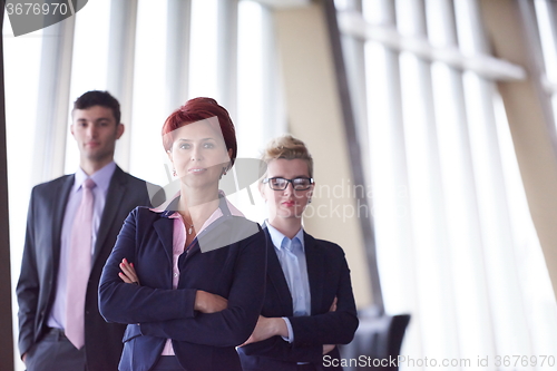 Image of diverse business people group with redhair  woman in front