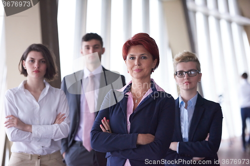 Image of diverse business people group with redhair  woman in front