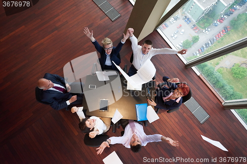 Image of top view of business people group throwing dociments in air