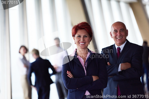 Image of diverse business people group with redhair  woman in front