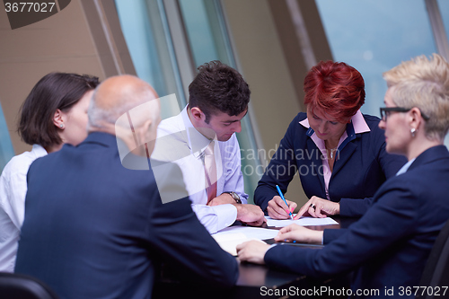 Image of business people group sign contract