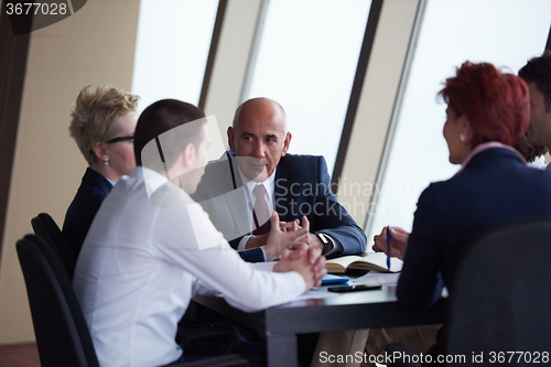 Image of business people group on meeting at modern bright office