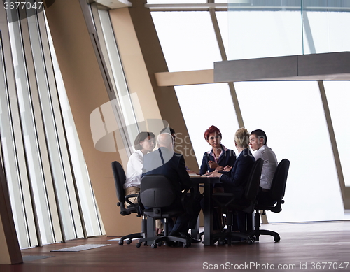 Image of business people group on meeting at modern bright office