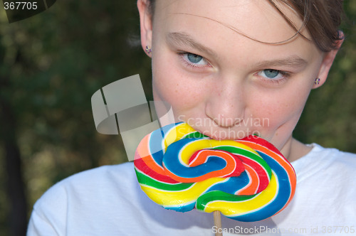 Image of teenager with lollipop