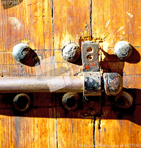 Image of rusty  brown    morocco in africa the old wood  facade home and 