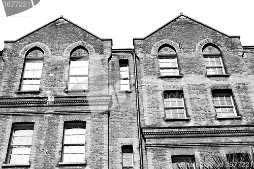 Image of old windon in england london brick and glass the wall 