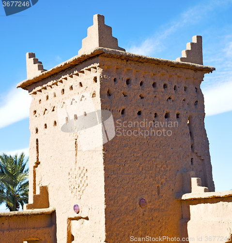 Image of brown old  construction in  africa morocco and  clouds  near the