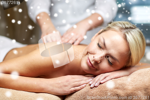 Image of close up of woman having back massage in spa