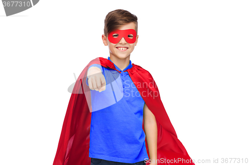 Image of happy boy in red superhero cape and mask