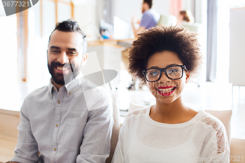 Image of happy creative team in office