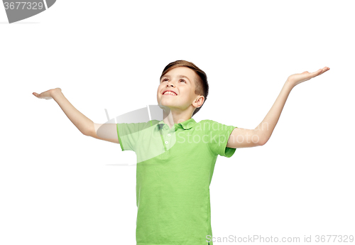 Image of happy boy in polo t-shirt raising hands up