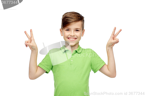 Image of happy boy showing peace or victory hand sign