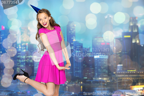 Image of happy young woman or teen girl in party cap